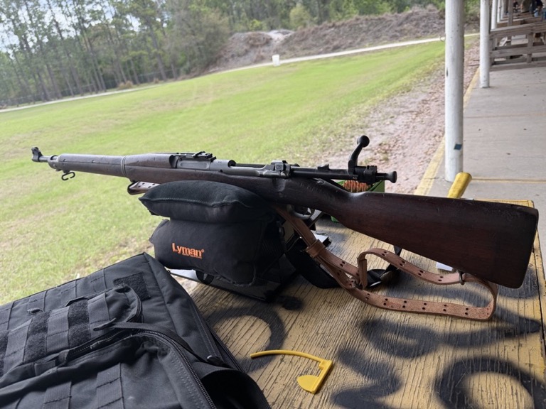 Classic rifle on shooting bench at range