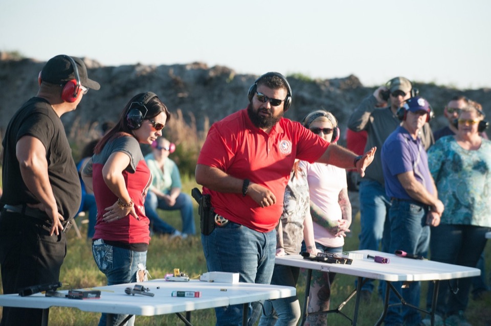 Josh Rodriguez instructing students at the range