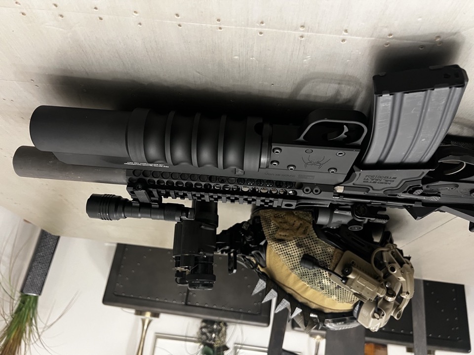 Suppressed AR-15 rifle with night vision helmet at USS Academy