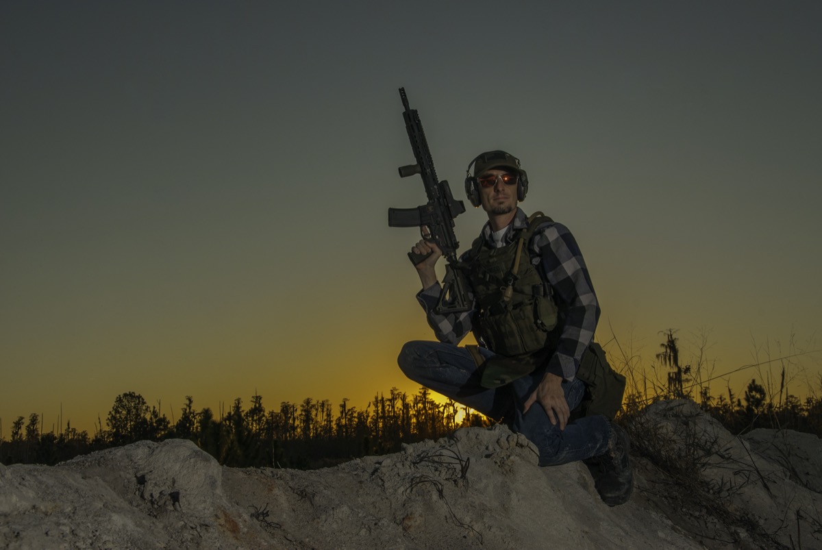 USS Academy tactical operator at sunset