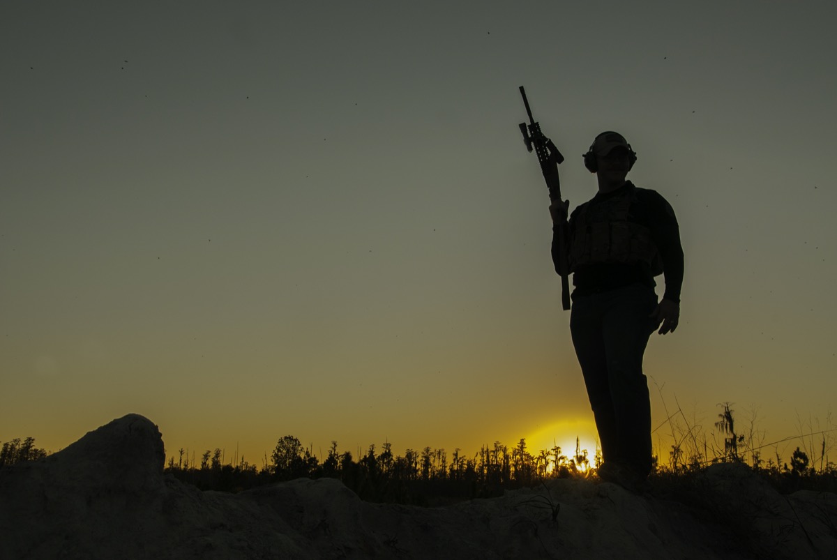 USS Academy tactical operator at sunset