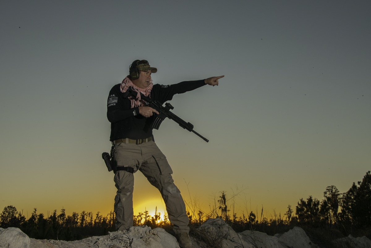 USS Academy tactical operator at sunset