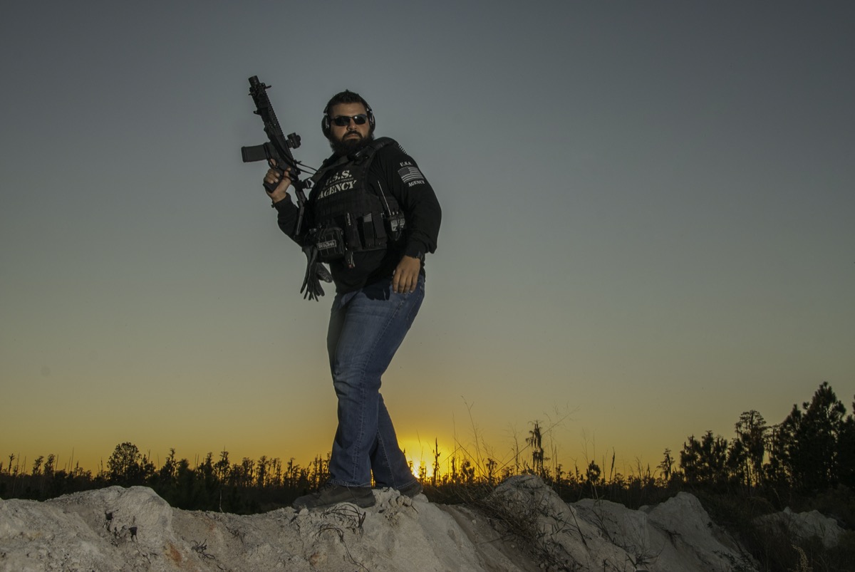 USS Academy tactical operator at sunset
